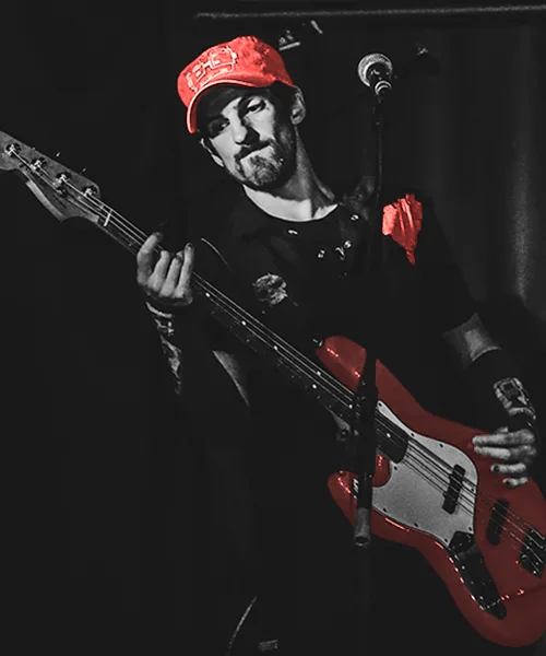 Kevin Murphy plays bass on stage