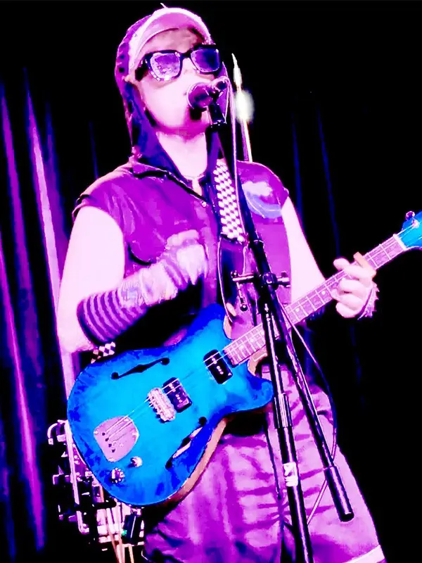 Shorty BryBry sings and plays an electric ukulele on stage