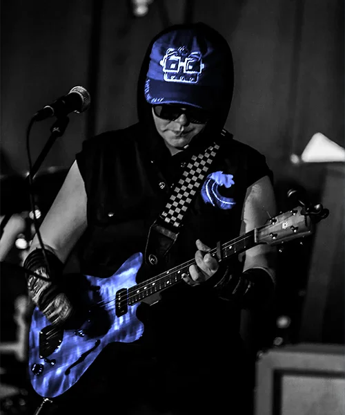 Shorty BryBry strums an electric baritone ukelele